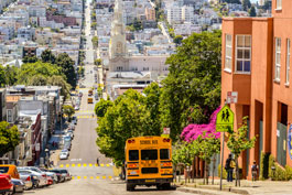 School bus parked in front of a school on a San Francisco street