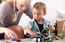 Mom engaged in play with attentive child