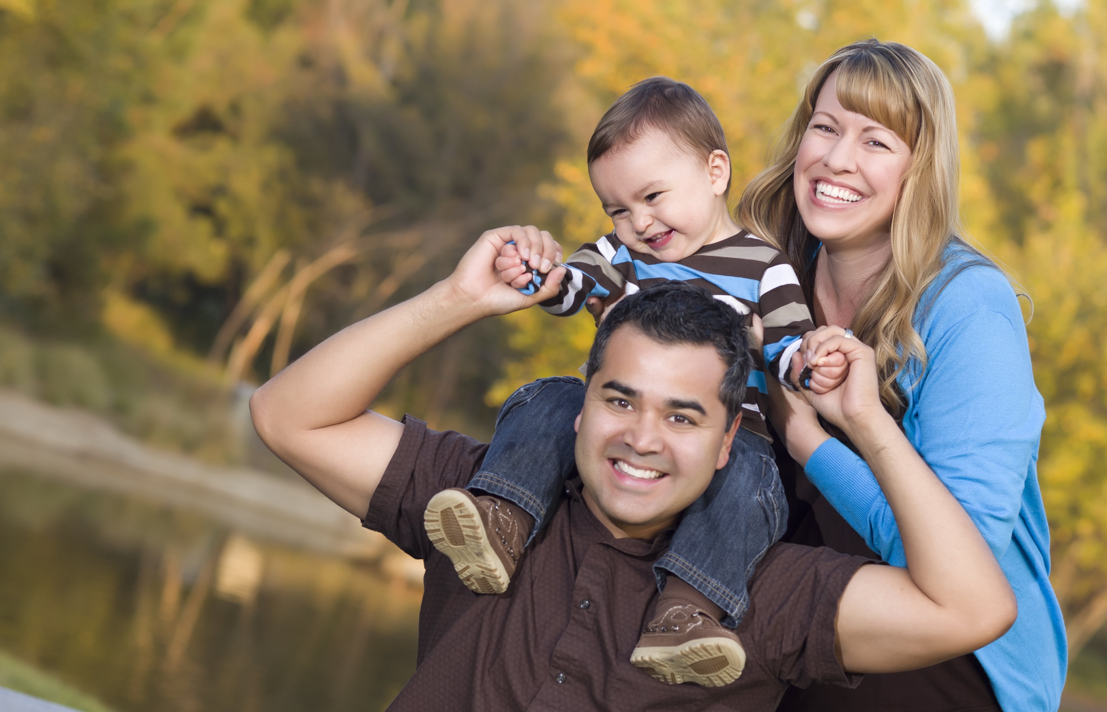 Happy Mixed Race Ethnic Family Posing for A Portrait