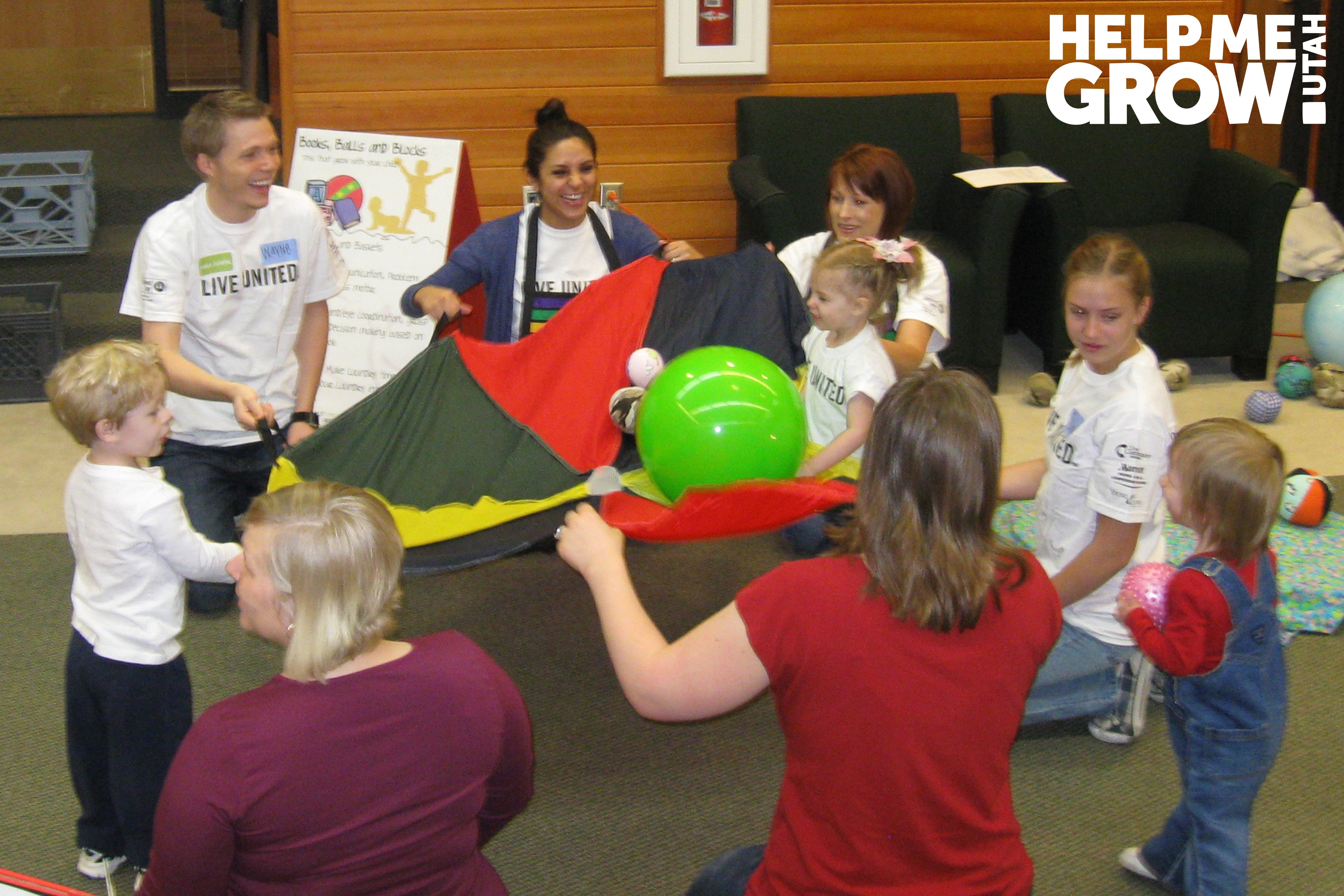 Mother and young daughter stack blocks together at a Books Blocks & Balls event in Utah