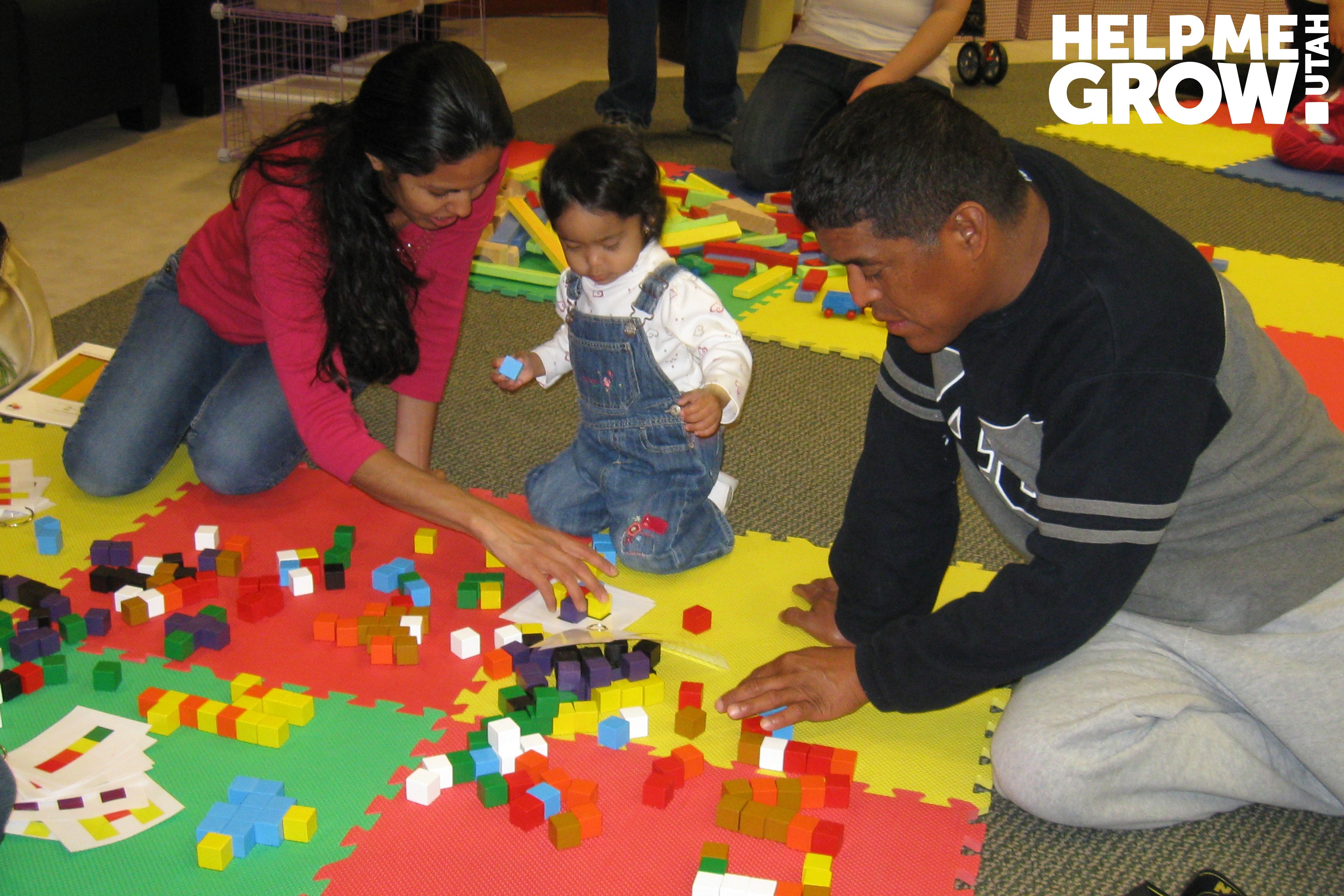 Mother and young daughter stack blocks together at a Books Blocks & Balls event in Utah